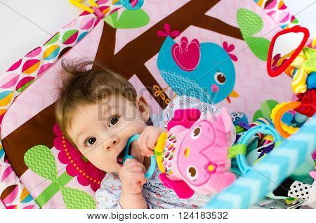 Baby Girl Palying In An Activity Gym