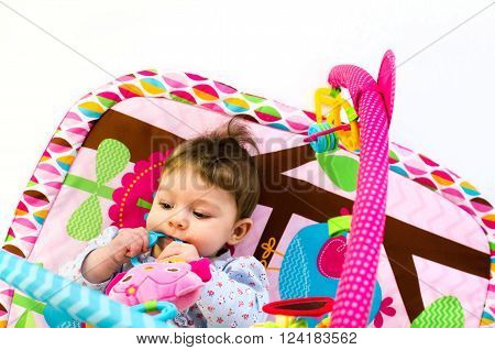 Baby Girl Palying In An Activity Gym