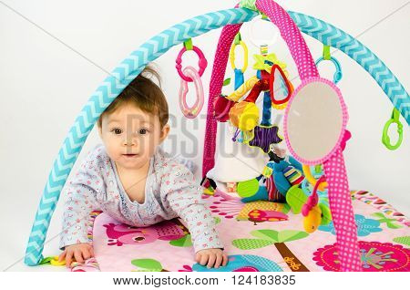 Baby Girl Palying In An Activity Gym