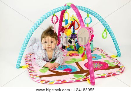 Baby Girl Palying In An Activity Gym