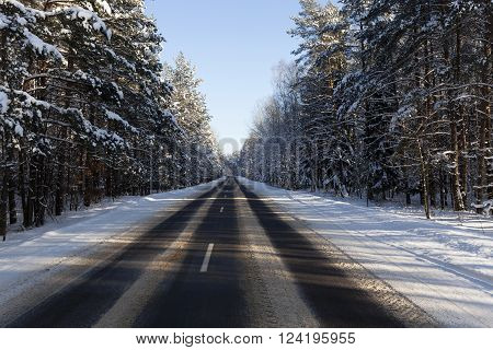 Photographed Road In The Winter. Winter, The Road Is Covered With Snow