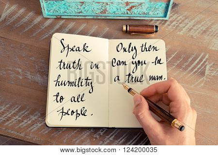 Retro effect and toned image of a woman hand writing on a notebook. Handwritten quote Speak truth in humility to all people. Only then can you be a true man as inspirational concept image