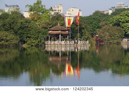 HANOI, VIETNAM - DECEMBER 13, 2015: Sword lake and temple jade on a sunny day. The historic landmark of the city of Hanoi, Vietnam