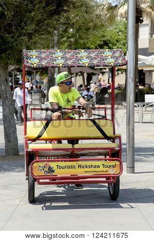 SPAIN, BARCELONA, JUNE, 27, 2015 - Bicycle rickshaw waiting for customers in Barcelonas street, Catalonia. Cycle rickshaw - very popular local transport.
