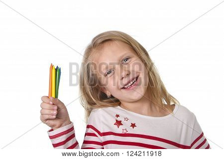6 or 7 years old beautiful little girl holding multicolor crayons set in art school children education concept isolated on white background
** Note: Soft Focus at 100%, best at smaller sizes