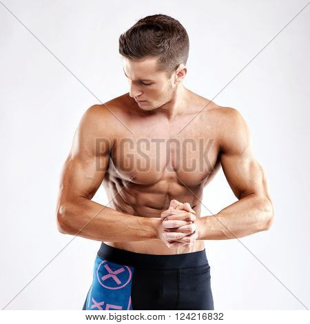 Bodybuilder Man Posing, Showing Perfect Abs, Houlders, Biceps, Triceps, Chest