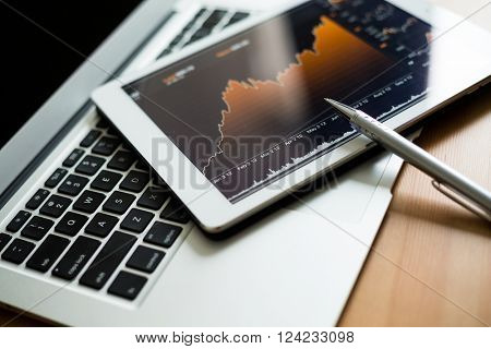 Tablet with stock exchage graph