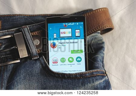 SARANSK, RUSSIA - April 3, 2016: Photo of Smartphone in a jeans pocket with Firefox application in a Google Play Store on the screen.