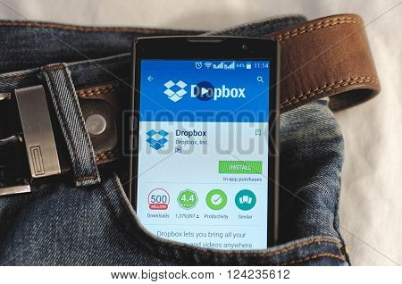 SARANSK, RUSSIA - APRIL 3, 2016: Photo of Smartphone in a jeans pocket with Dropbox application in a Google Play Store on the screen.