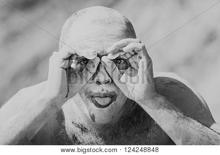 Portrait unny of a man in the clay showing tongue. Black and white photo
** Note: Visible grain at 100%, best at smaller sizes