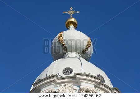 Dome of the church in the Smolny Monastery on blue sky background in St.Petersburg Russia.