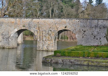 Historic stone bridge the entrance to the castle Cervena Lhota South Bohemia Czech Republic