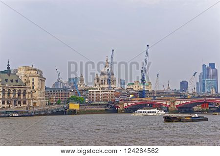 St Paul Cathedral and Blackfriars Bridge on Northern Bank of River Thames in London UK. Saint Paul Cathedral is Anglican church. Blackfriars Bridge is a traffic and road bridge over Thames River