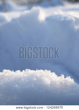 The sunny snow on a blurred background