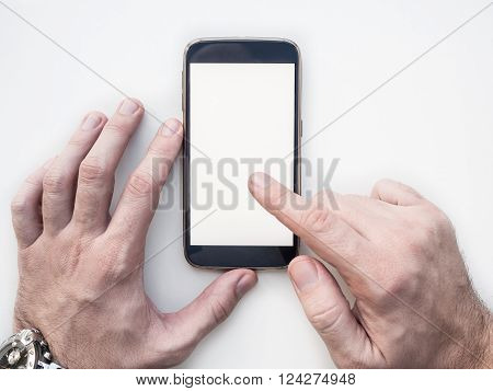 Close up of man's nahds using mobile smartphone mock up with white screen