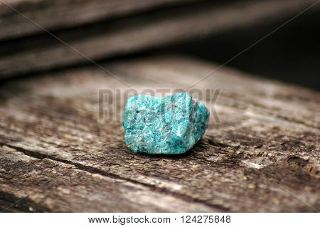 Bright uncut apatite stone on a wooden background
** Note: Soft Focus at 100%, best at smaller sizes
