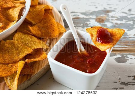 Close up of chili sauce and nachos chips