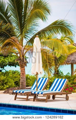 Beach chairs at tropical resort in exotic island