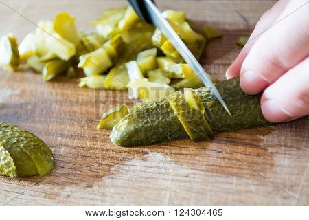 Closeup of pickles beeing cutted with knife.
** Note: Soft Focus at 100%, best at smaller sizes