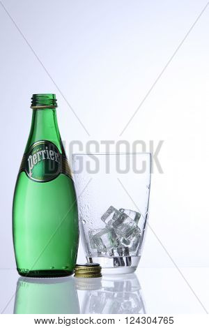 KUALA LUMPUR, MALAYSIA - Feb 17, 2016 perrier drinking water with glass with ice cube