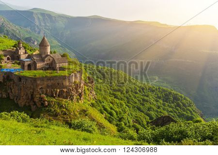 Ancient monastery in setting sun. Tatev. Armenia
