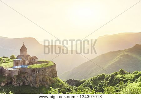 Ancient monastery in setting sun. Tatev. Armenia