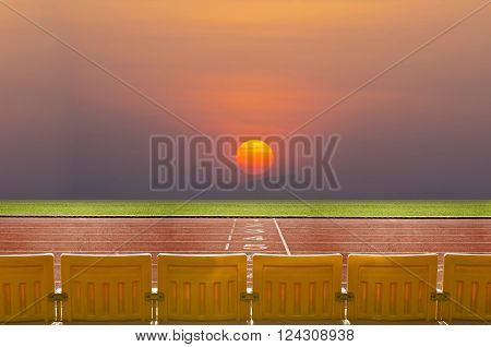 Empty seats in stadiuim with the sunrise in the morning.