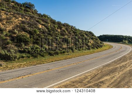 Bend in the road wrapping around a hillside in southern California near Castaic.