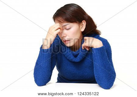 portrait of Asian woman suffers from Asthenopia
