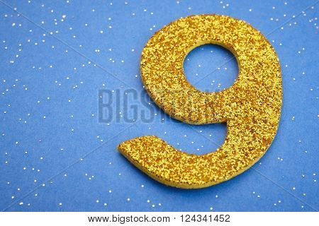 Number nine yellow color over a blue background. Anniversary. Horizontal
