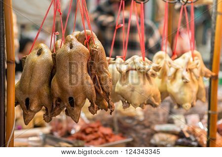 Roasted duck and boiled chicken on display in Yowarat Chinatown Bangkok Thailand.