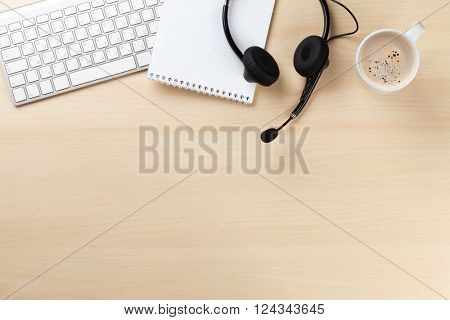 Office desk with headset and pc. Call center support table. Top veiw with copy space