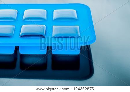 Ice cube tray with ice on the tablel