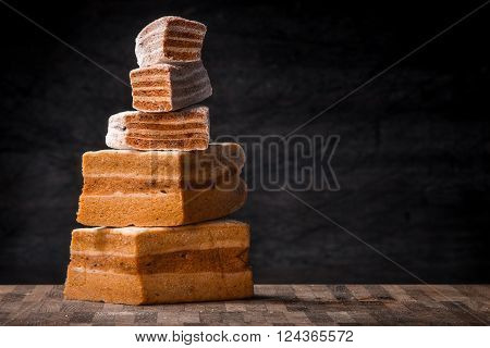 Pyramid of pastila pieces on the wooden table horizontal