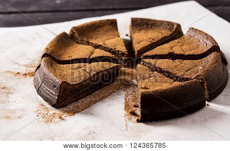 Chocolate cake with ricotta sprinkled with cocoa powder