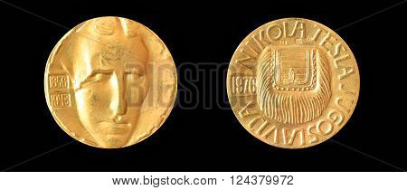 YUGOSLAVIA - CIRCA 1976 : Gold medallion, made by Zlatara Majdanpek - Yugoslavia, that shows portrait of scientist Nikola Tesla.