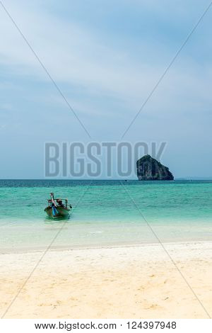 A small fishing boat moored on the beach, Tub island Krabi Thailand