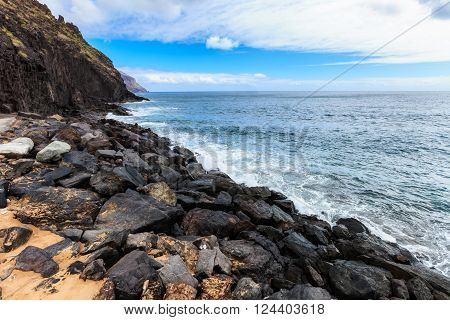 Summer seascape on tropical island Tenerife, Canary in Spain. Playa de Las Teresitas beach with gold sand brought from Sahara desert view on capital city Santa Cruz De Tenerife.