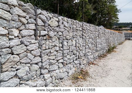 Slope Retention Management With Rocks And Wire Mesh Cage System