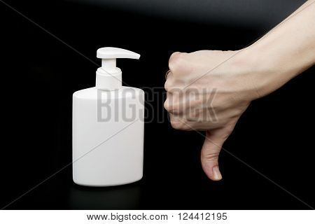 Liquid Soap Dispenser And A Human Hand.closeup