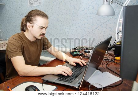 Young Hardware Engeneer In Workplace