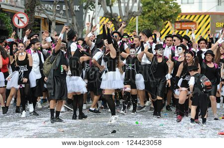 LIMASSOL CYPRUS - MARCH 13 : Happy people in teams dressed with colorful costumes at famous Limassol Carnival Parade on March 13 2016 in Limassol town Cyprus.
