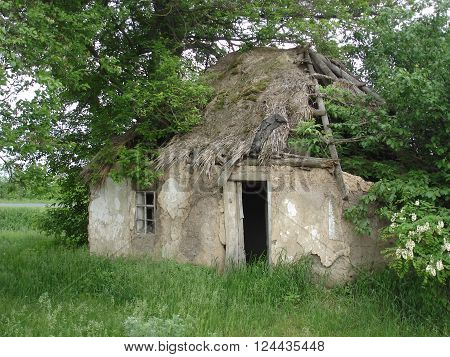 abandoned clay house, broken peasant country house