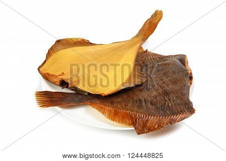 Two hot smoked flatfish on plate isolated on white