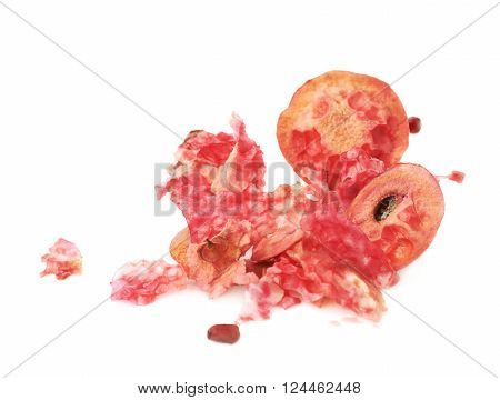 Eaten pomegranate remains and lumps isolated over the white background