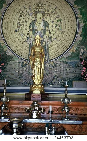 GYEONGJU CITY, NORTH GYEONGSANG PROVINCE / KOREA - CIRCA 1987: A Buddhist image stands on an altar in the Bulguksa Buddhist Temple.