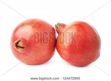 Two pomegranate punica granatum fruits composition isolated over the white background