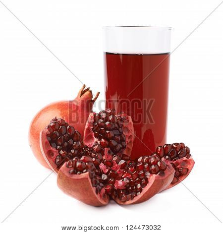 Pomegranate Punica granatum fruit next to the tall glass full of red juice, composition isolated over the white background