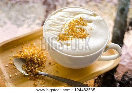 Milk honey with foam topping and sugar for coffee break in morning time.