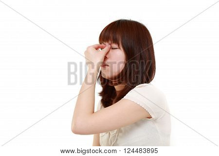 portrait of young Japanese woman suffers from Asthenopia